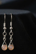 Sunstone wire wrapped dangle earrings in silver