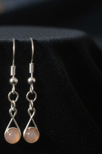 Sunstone wire wrapped dangle earrings in silver