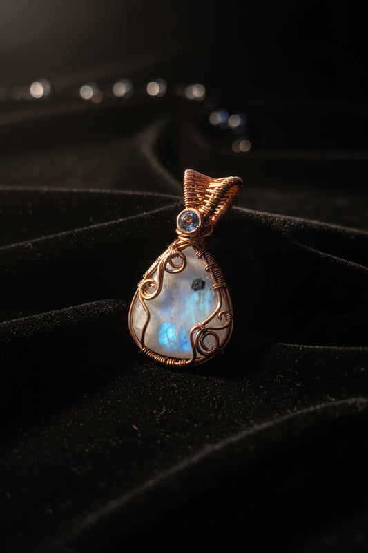 Rainbow moonstone stone with blue topaz bail copper pendant