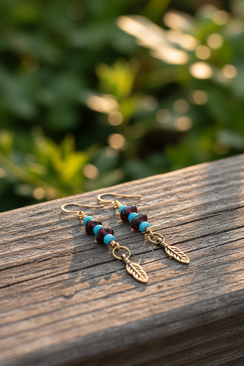 Garnet and turquoise earrings with a feather charm